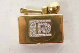 An Art Deco 18ct gold pocket lighter by S.A.M., Paris, France, design patented in 1926 by Strauss,