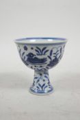 A Chinese Ming style blue and white porcelain stem cup decorated with waterfowl in a lotus pond, 6