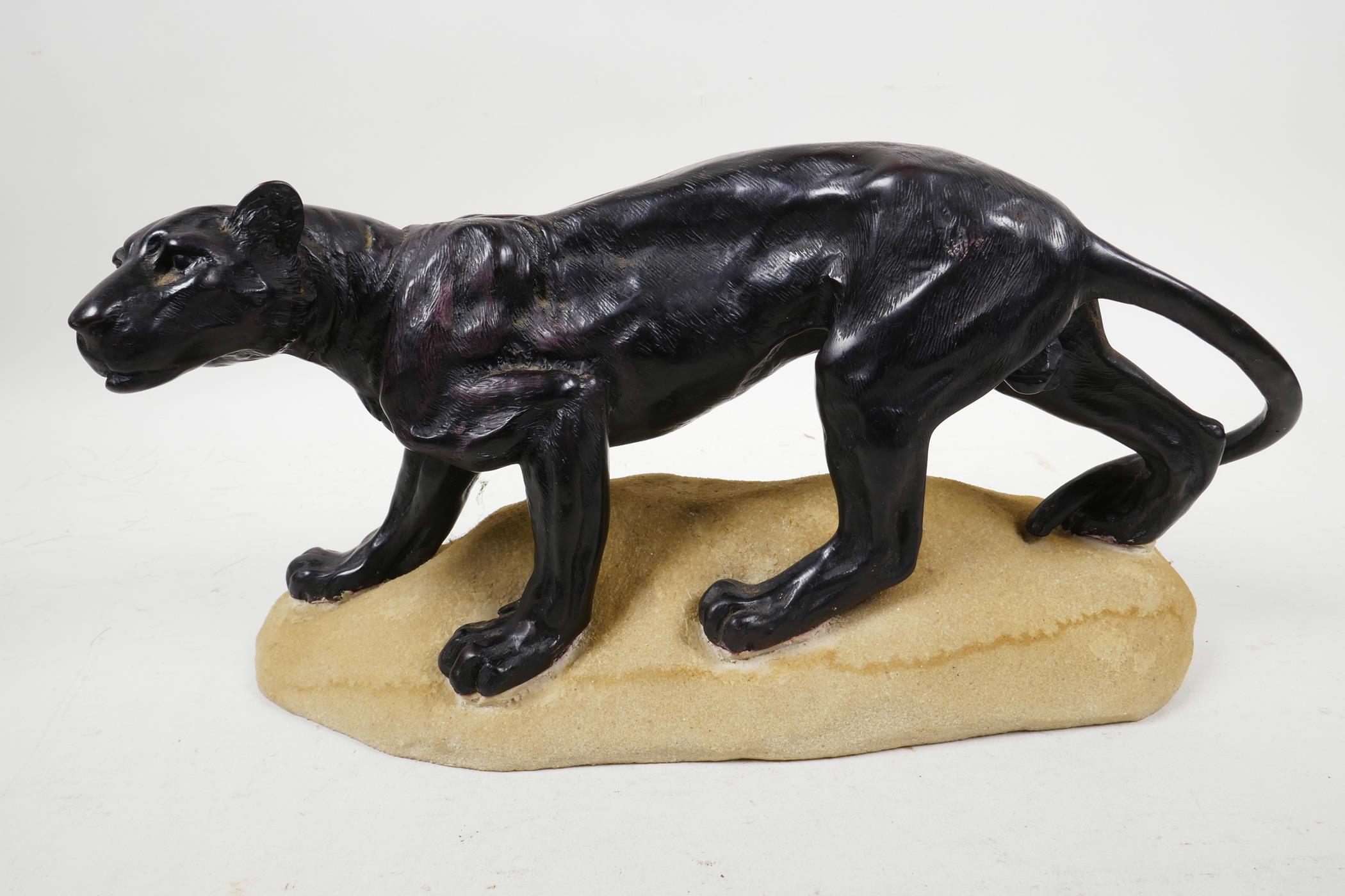 A well cast composition model of a Jaguar, resembling bronze, 10" long x 5½" high
