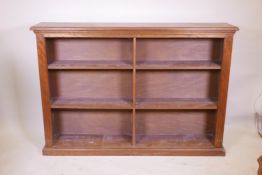 A mahogany open bookcase with reeded decoration, 60" x 11" x 42"