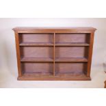 A mahogany open bookcase with reeded decoration, 60" x 11" x 42"