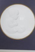 A plaster relief of a child, signed E. Sheen and dated 1916, 6" diameter (framed)