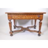 An C18th Continental marquetry inlaid walnut table with a single drawer and tapering legs united