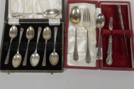 A boxed set of six hallmarked silver coffee spoons, together with a boxed christening pair of