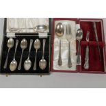 A boxed set of six hallmarked silver coffee spoons, together with a boxed christening pair of