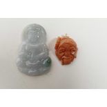 A Chinese green hardstone pendant carved in the form of Buddha, together with a carved coral pendant