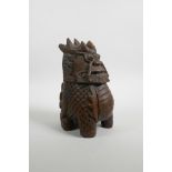 A Chinese carved wood figure of a stylised kylin, 8" high, A/F losses