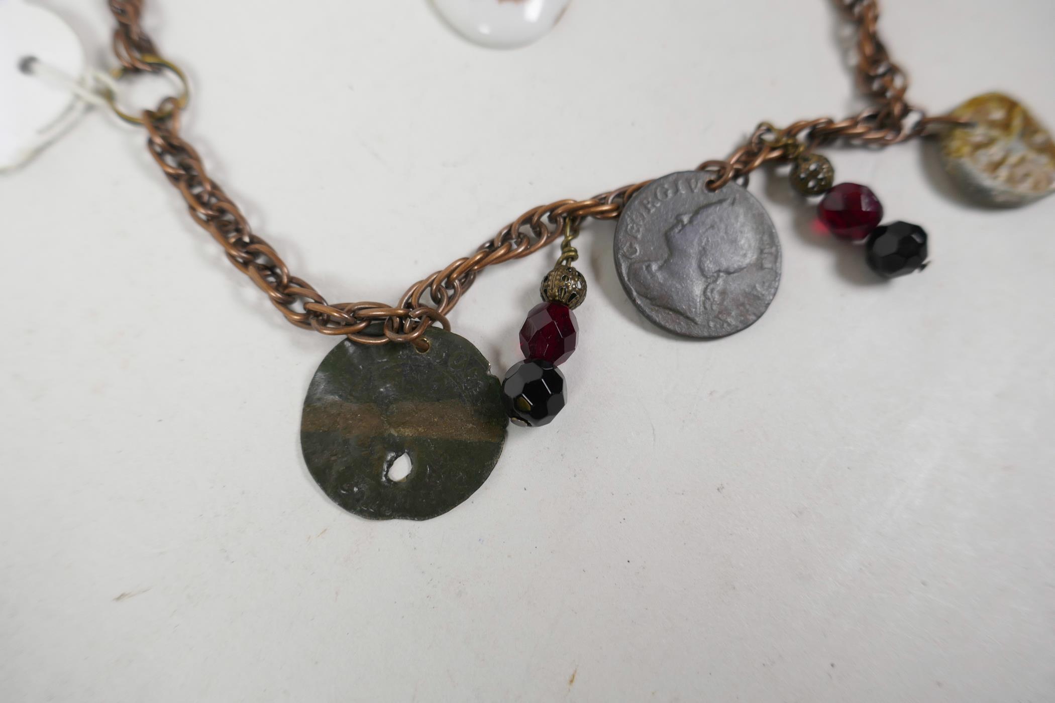 A twin strand charm bracelet set with replica medieval coins and tokens, 12" long, and a Limoges - Image 2 of 5