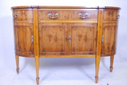 A Bevan Funnell yew wood 'D' shaped Regency sideboard with single fitted drawer on tapering supports