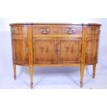 A Bevan Funnell yew wood 'D' shaped Regency sideboard with single fitted drawer on tapering supports