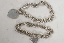Two Tiffany link bracelets, one with padlock, the other with a heart, total 71g