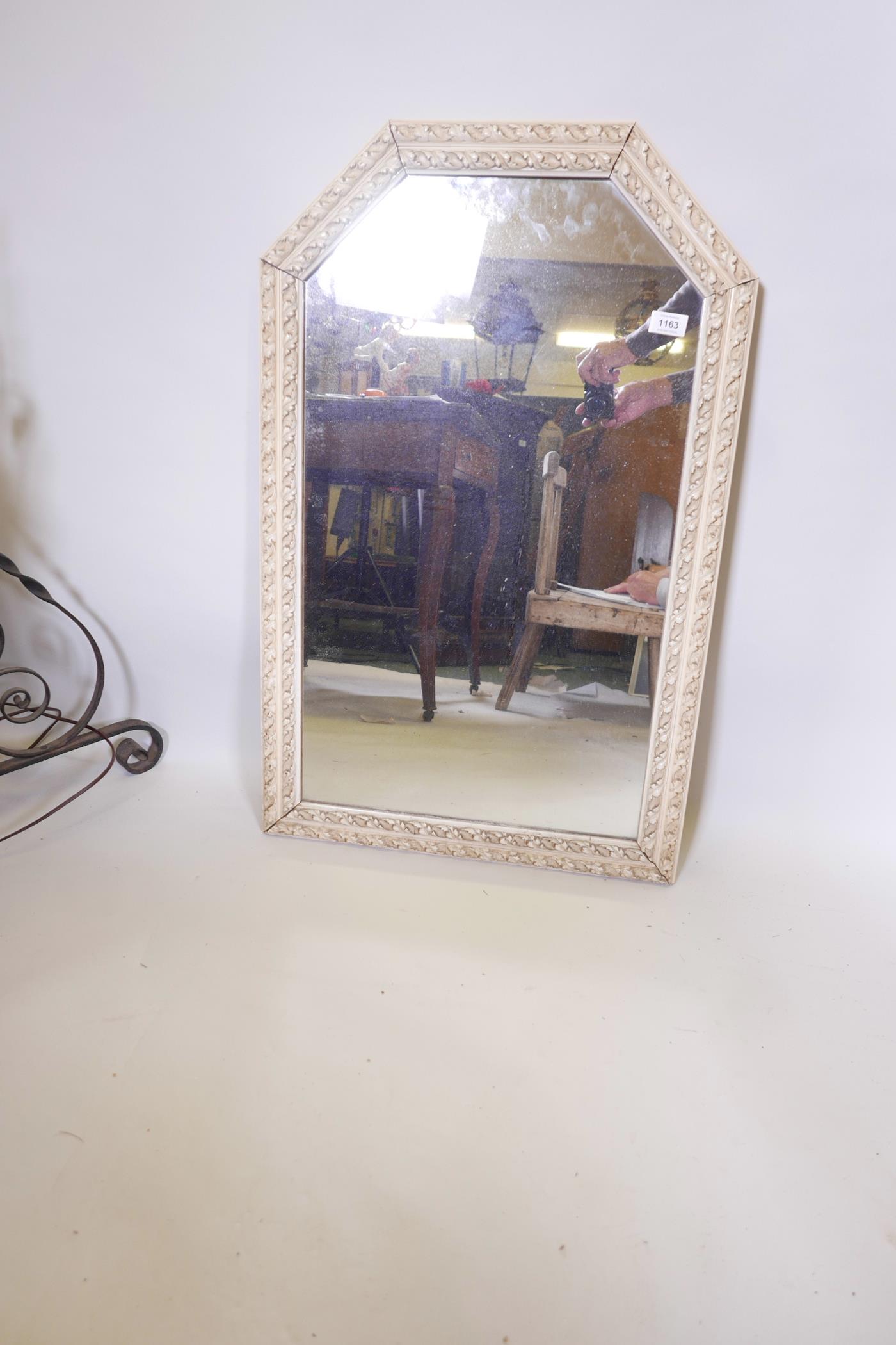 An arch top wall mirror with painted double acanthus leaf rope moulded frame, 33½" x 22"