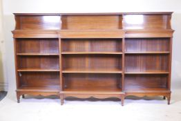 A C19th mahogany breakfront open bookcase, the upper section with dentil moulded edge, the lower