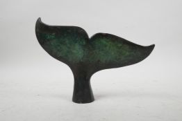 A bronze sculpture of a humpback whale's fluke, 7" wide