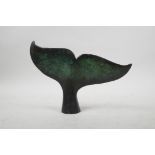 A bronze sculpture of a humpback whale's fluke, 7" wide