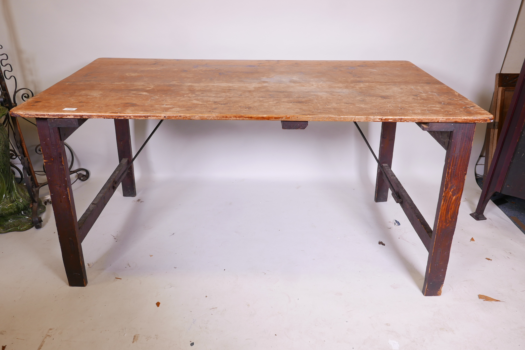 An antique pine trestle table with plank top, 60" x 32" x 30"
