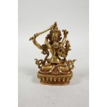 A Sino-Tibetan gilt metal figure group of two copulating deities, impressed mark to base, 3½" high