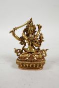 A Sino-Tibetan gilt metal figure group of two copulating deities, impressed mark to base, 3½" high