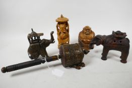 A collection of Asian artefacts: a Sino-Tibetan carved wood prayer spinner with long prayer