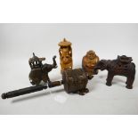 A collection of Asian artefacts: a Sino-Tibetan carved wood prayer spinner with long prayer