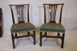 A pair of Georgian wide seat mahogany dining chairs, with pierced splat backs and handcrafted
