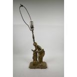 A brass table lamp in the form of a classical woman, 20" high