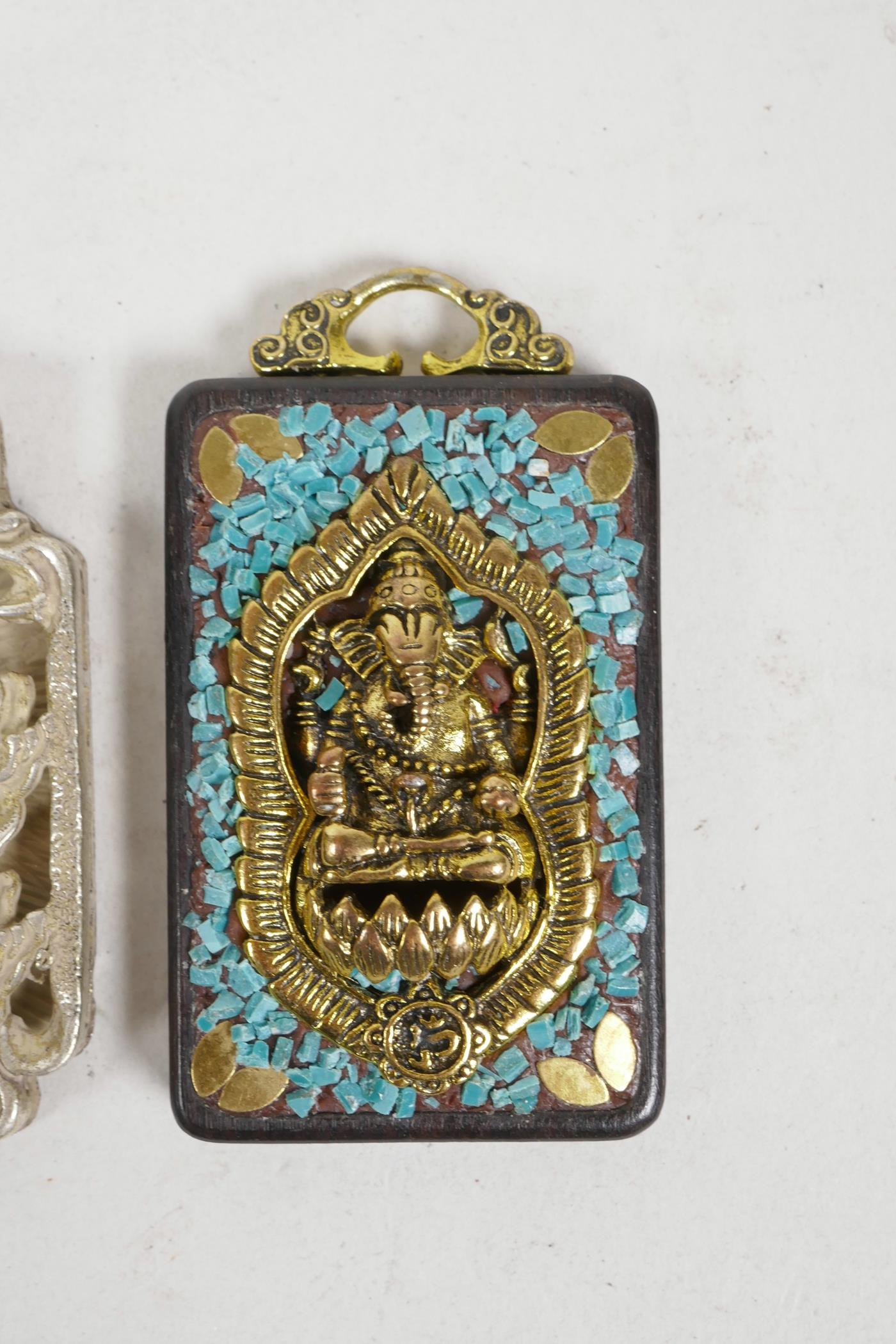 A Chinese white metal pendant decorated with a warrior, together with an Indian pendant decorated - Image 3 of 3
