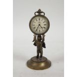 A brass desk clock in the form of a cherub holding aloft a pocket watch, 4½" high