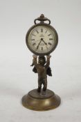 A brass desk clock in the form of a cherub holding aloft a pocket watch, 4½" high