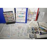 A collection of all world postage stamps, in two albums, collection strips and loose