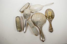 A collection of hallmarked silver dressing table items, three hand mirrors and four brushes