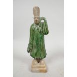 A Chinese Tang dynasty (618-907AD) terracotta figure of a standing male court attendant, Sancai