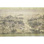 A Chinese printed scroll decorated with figures in an extensive landscape, 10½" high