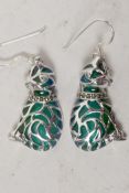 A pair of silver and plique a jour earrings in the form of cats