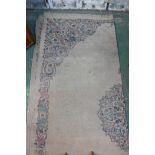 An antique Oriental carpet, with central medallion and scrolling borders, pile worn, 120" x 154"