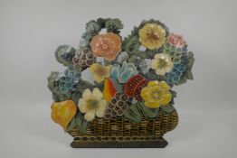 A hand painted metal fire guard/screen in the form of a basket full of flowers, 15" high
