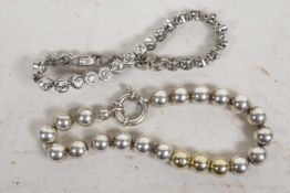 A Swarovski crystal tennis bracelet, together with an unmarked silver bead bracelet and a diamante