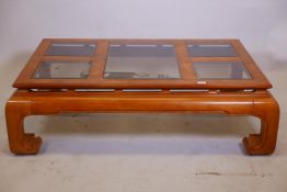 An Oriental style figured elm coffee table with five inset glass panels, 51" x 33" x 15"