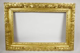 A C19th giltwood picture frame, with carved acorn and leaf decoration, rebate 14¾" x 24½"