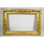 A C19th giltwood picture frame, with carved acorn and leaf decoration, rebate 14¾" x 24½"