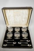 An Edwardian set of six cut glass grapefruit bowls and six silver plated grapefruit spoons by Thomas