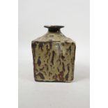 A beige drip glazed art pottery flask/bottle with underglaze impressed alphabet decoration, 6" high