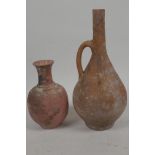 An antique unglazed red earthenware bottle vase with side handle, 9½" high, together with a
