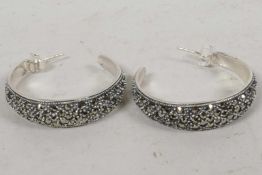 A pair of silver and marcasite hoop earrings