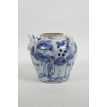 A Chinese blue and white porcelain pourer/pot with four lug handles and decorated with a stylised