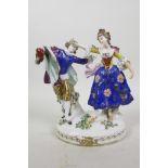 A C19th Chelsea style porcelain figure of an C18th courting couple, brightly hand painted in