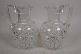 A pair of C19th cut glass jugs, 6½" high