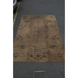 A gold ground carpet with stylised medallion decoration, possibly Irish, 106" x 138"