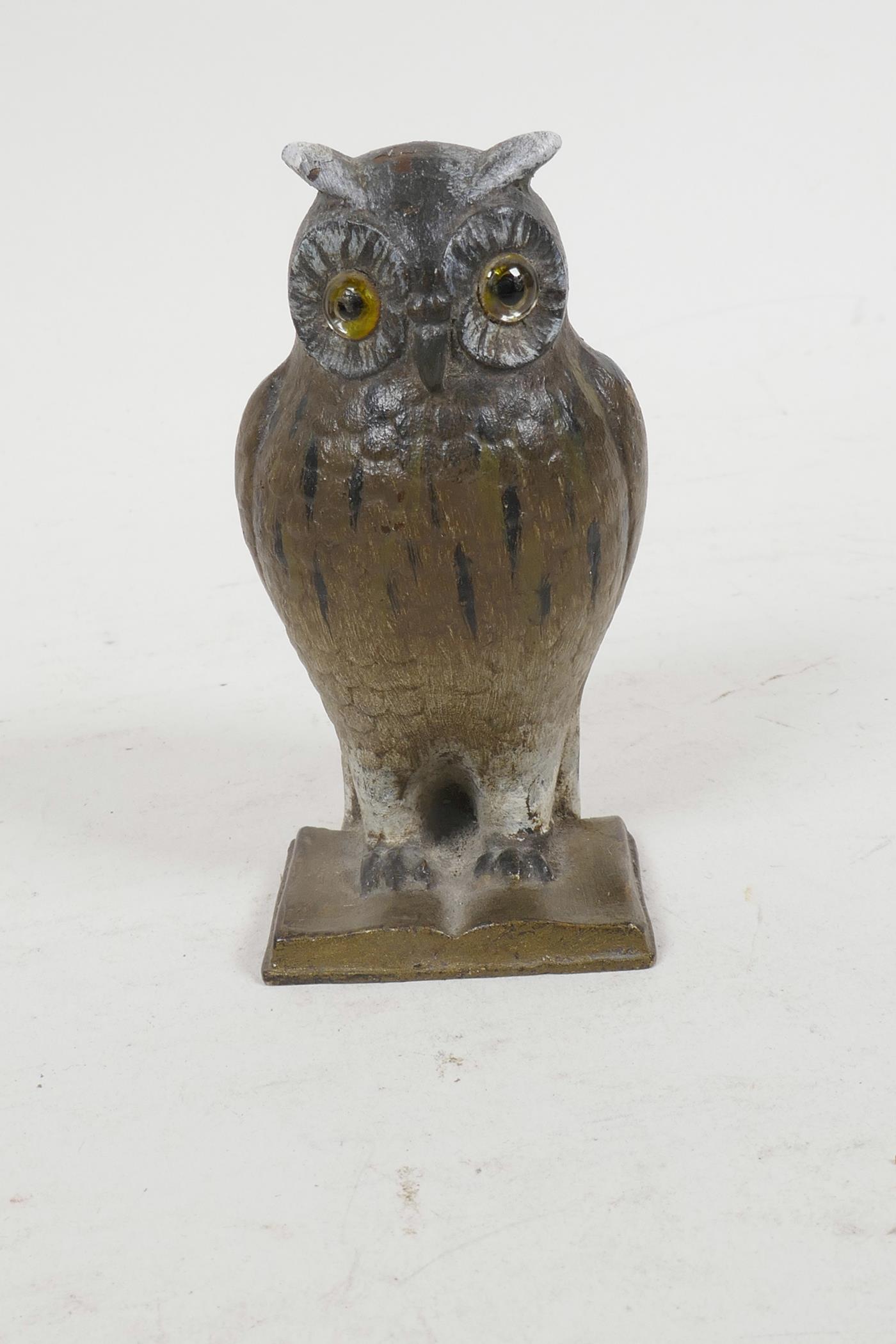 A cold painted bronze pin cushion cast as an owl