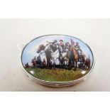 An oval silver and enamel pill box, the lid decorated with a group of American mounted Confederate